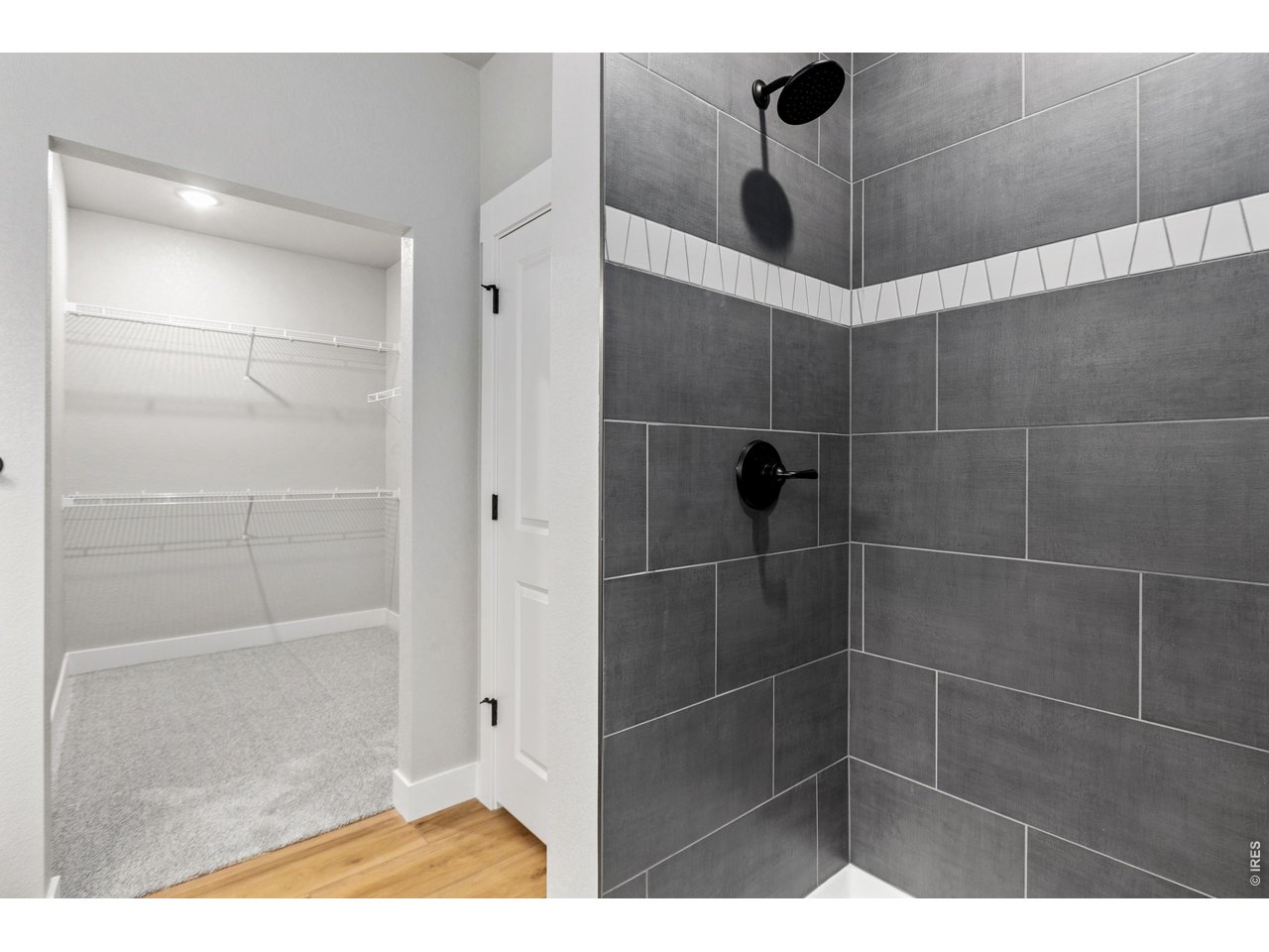 Property Photo 12 Primary shower. Finishes may vary.