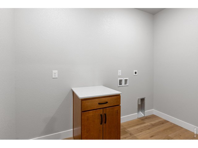 Property Photo 16 Laundry room. Finishes may vary.