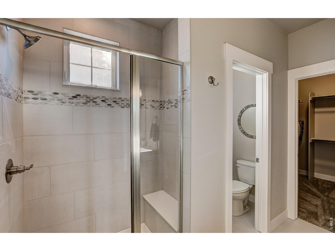 Property Photo 8 Primary shower. Finishes may vary.