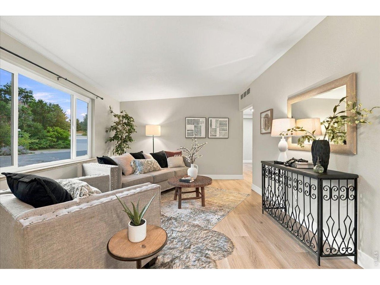 Property Photo 2 Living room, note newer vinyl windows and luxury Cementous tile plank floor and interior paint