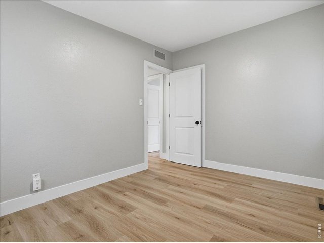 Property Photo 23 entrance to SE bedroom Note the newer white doors and trim throughout