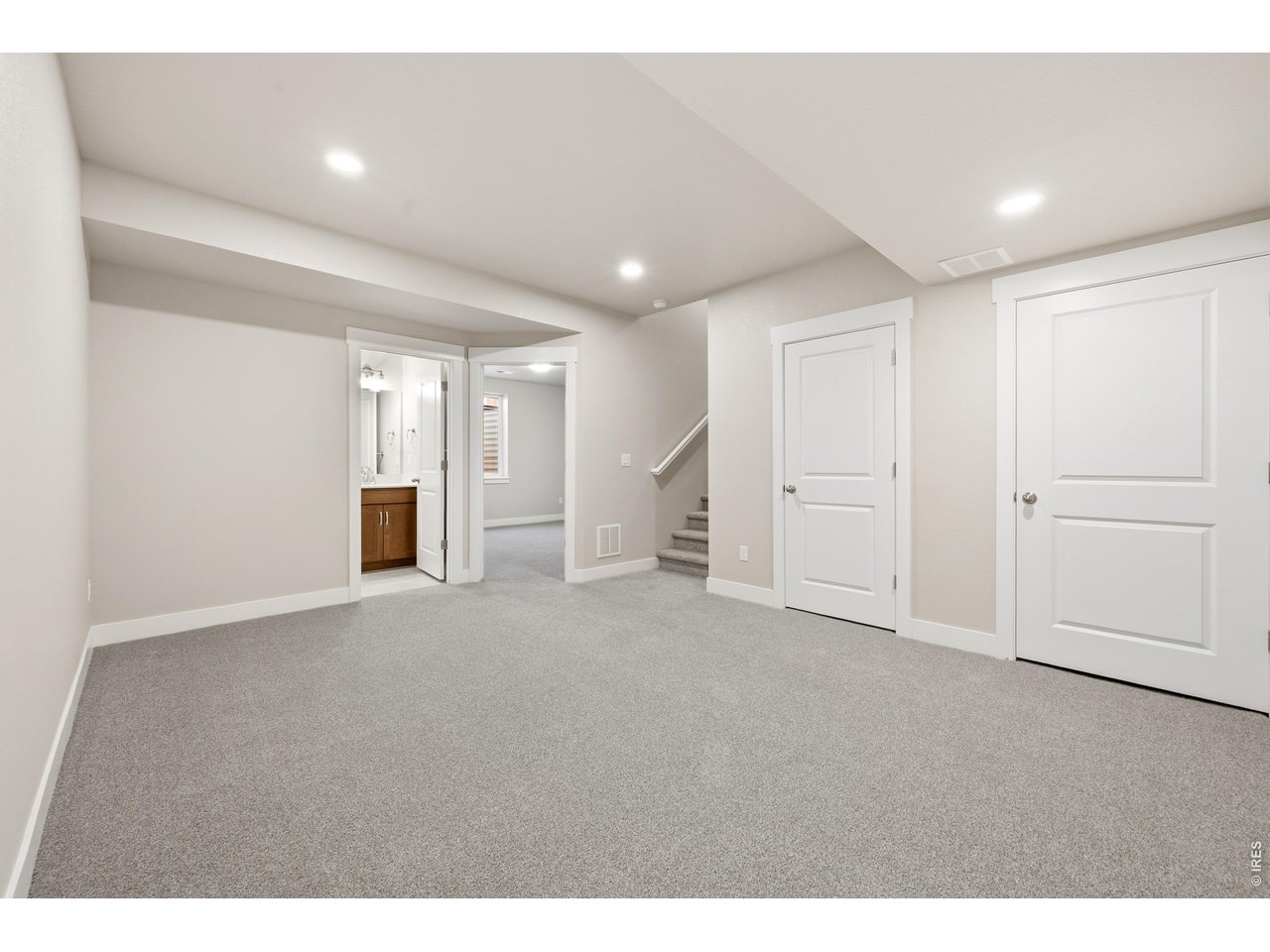 Property Photo 20 Finished basement with room to entertain, watch movies or play games.