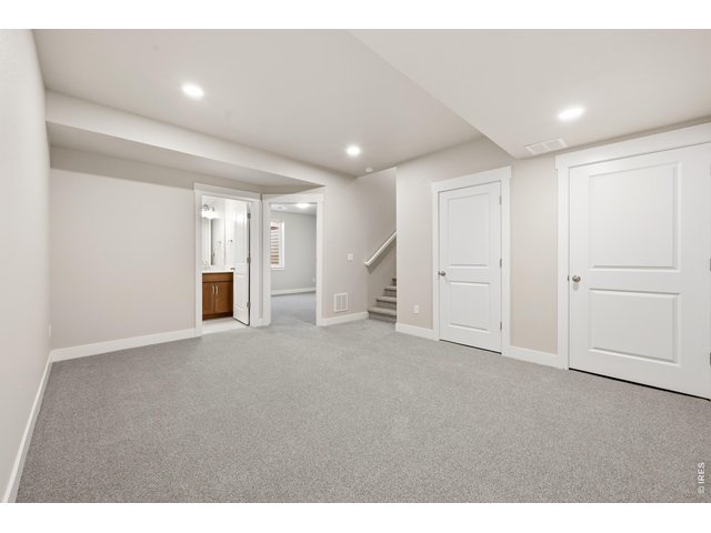 Property Photo 20 Finished basement with room to entertain, watch movies or play games.