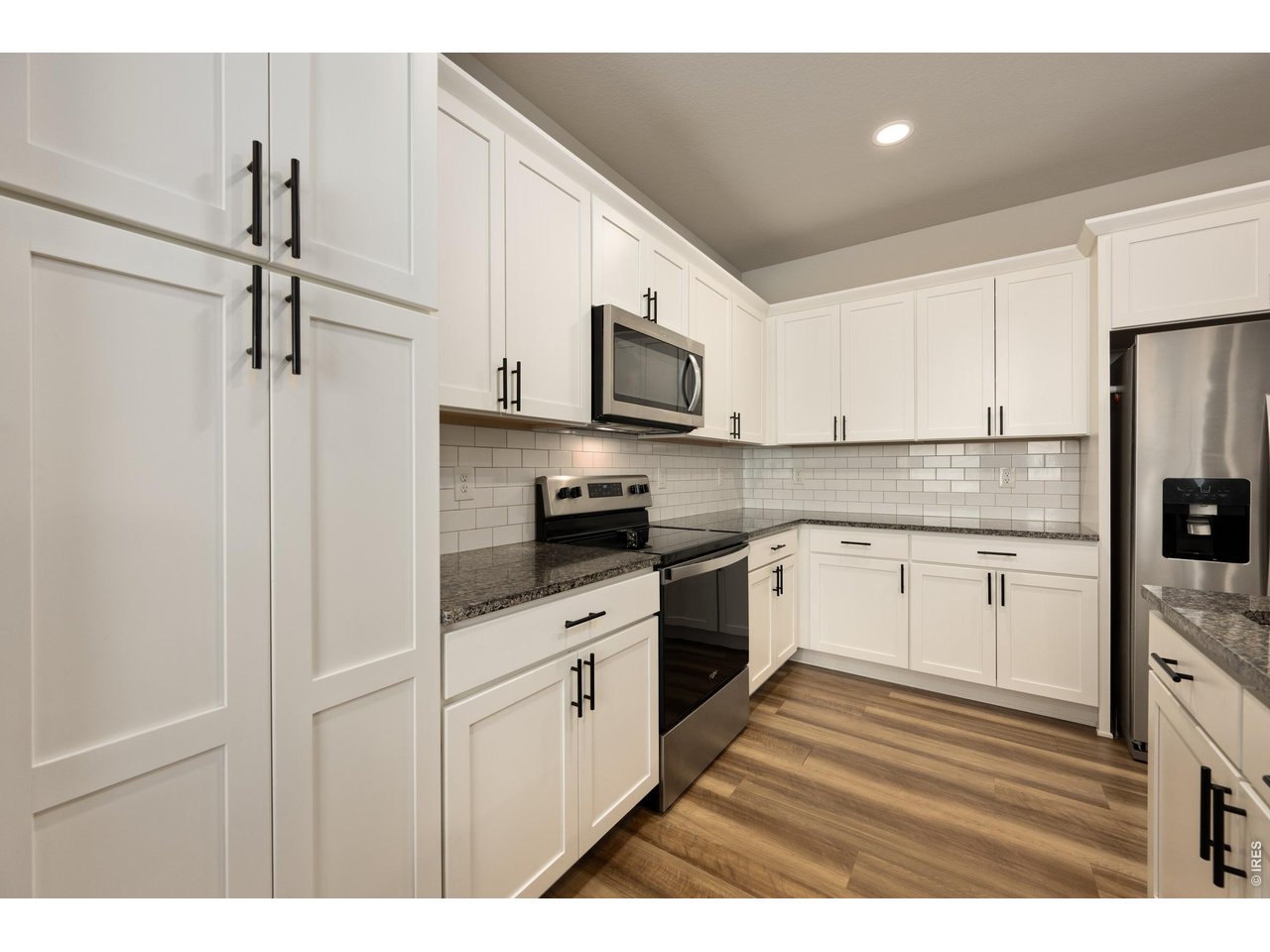 Property Photo 10 Stainless Steel Appliances & Subway Tile Backsplash