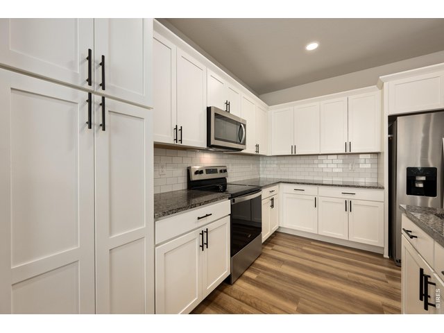 Property Photo 10 Stainless Steel Appliances & Subway Tile Backsplash