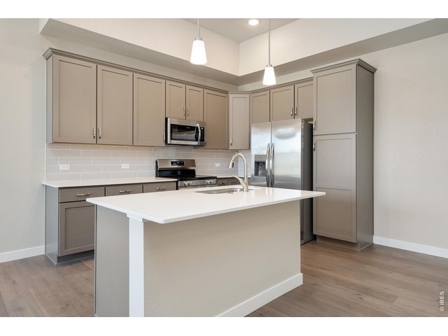Property Photo 7 Upgraded kitchen cabinets with lazy susan for extra storage.