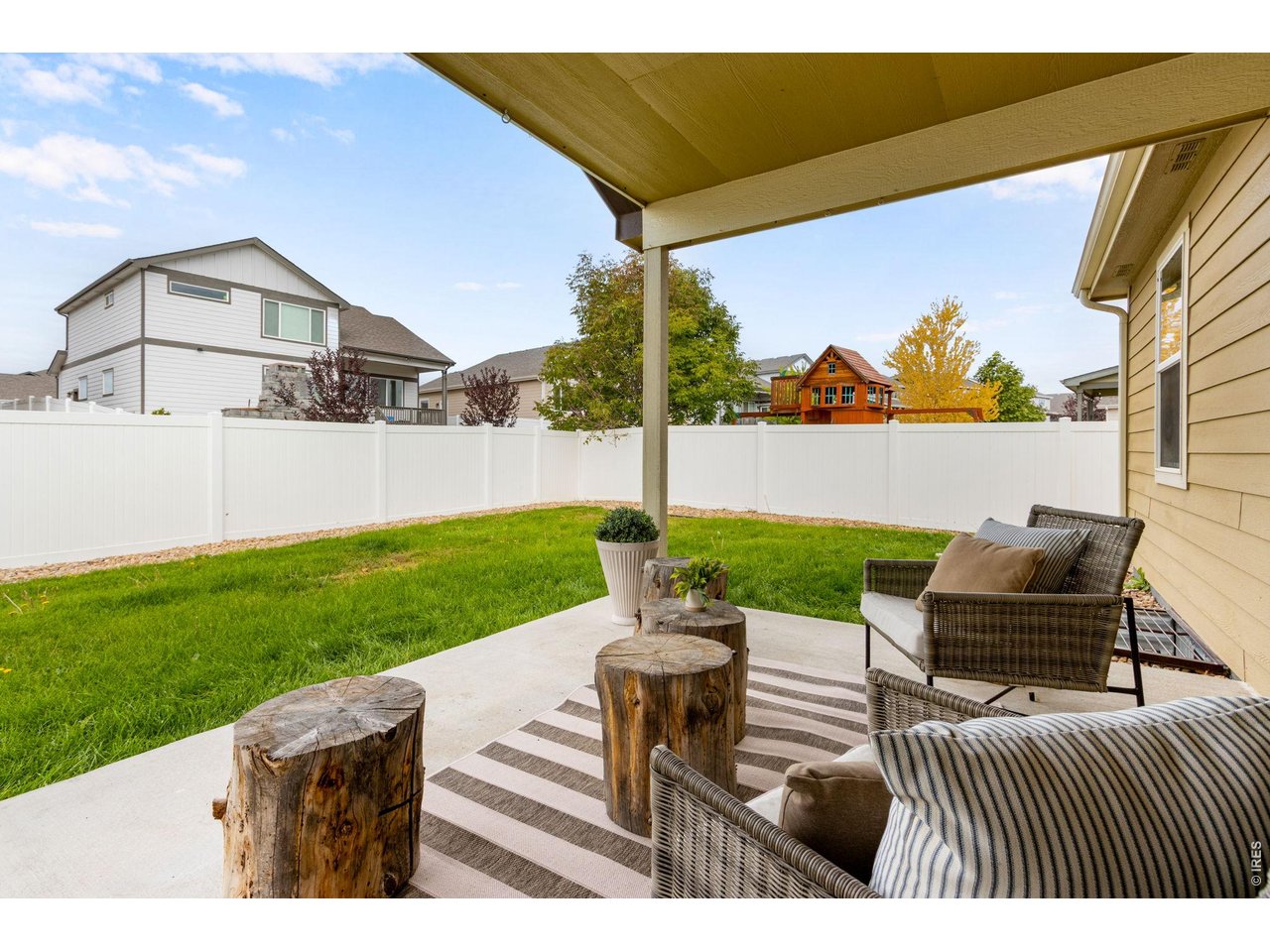 Property Photo 11 Adorable outdoor living! (Comes with the cute decorative wood stumps)