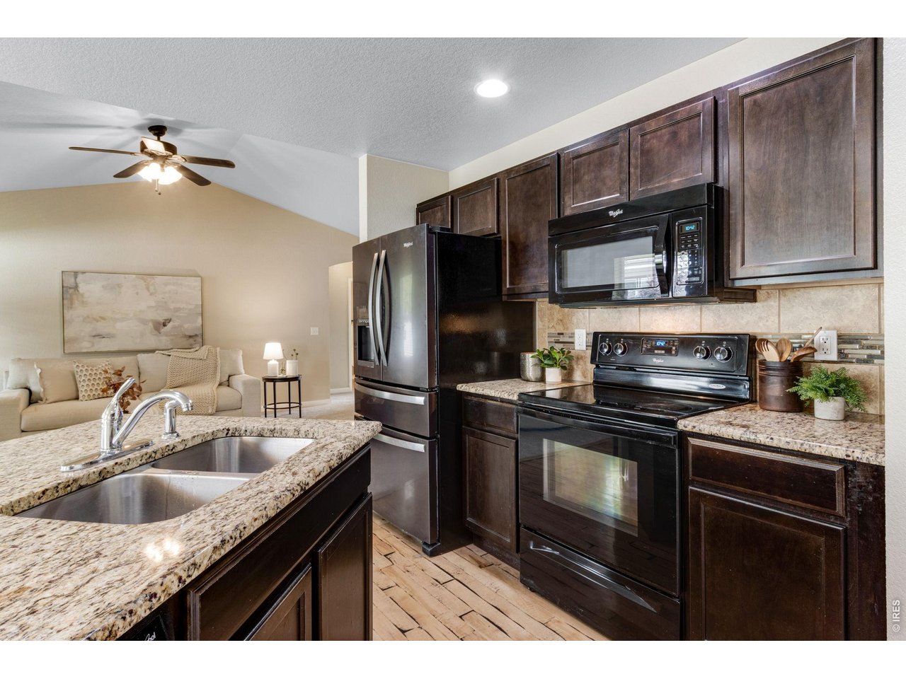 Property Photo 18 All countertops have slab granite countertops, full tile splash.