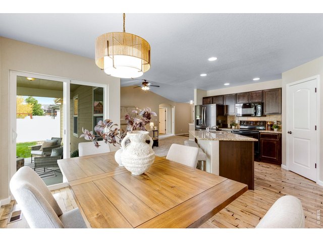 Property Photo 10 Slab Granite Countertops on everything counter throughout!  Hardwood floors in the kitchen and dining area.