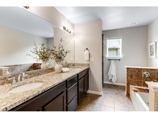 Property Photo 22 Spa-inspired 5 piece primary bathroom, equipped with excellent storage and countertop space!