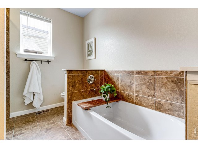Property Photo 23 Beautiful tile flooring and large soaker tub!