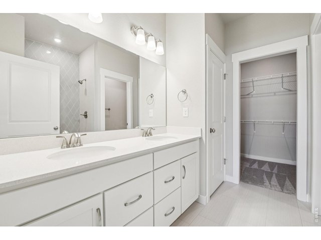 Property Photo 22 Primary bathroom with dual vanities