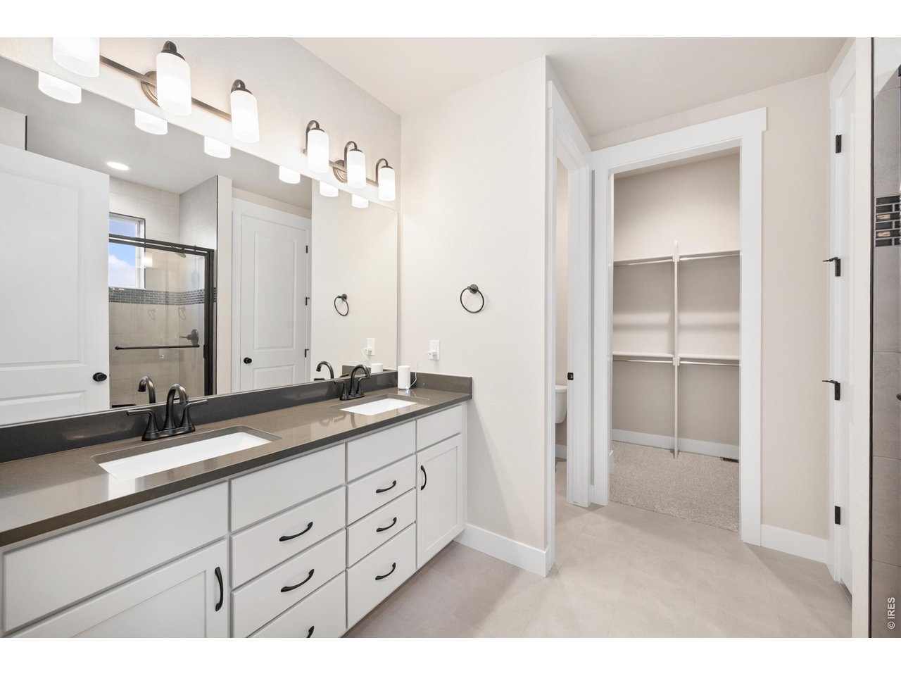 Property Photo 14 Primary bathroom with dual vanities