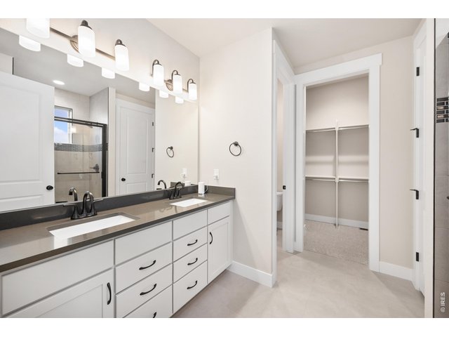Property Photo 14 Primary bathroom with dual vanities