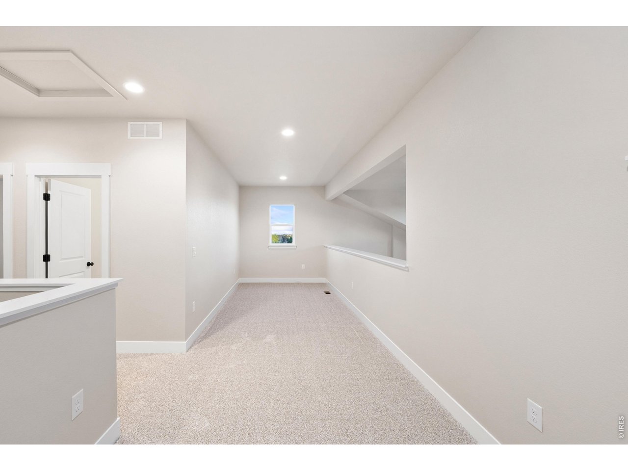 Property Photo 18 Upstairs loft area perfect for a home study, reading nook, exercise space or gaming area.