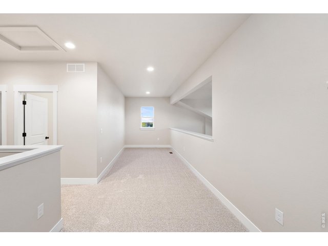 Property Photo 18 Upstairs loft area perfect for a home study, reading nook, exercise space or gaming area.