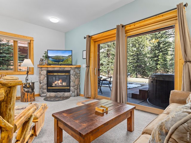 Property Photo 5 Large windows allow for light and views in the living spaces