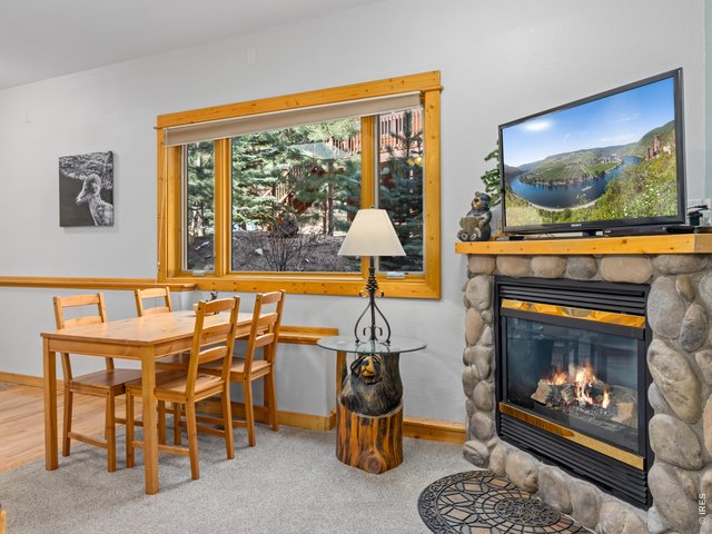 Property Photo 11 Dining and gas fireplace