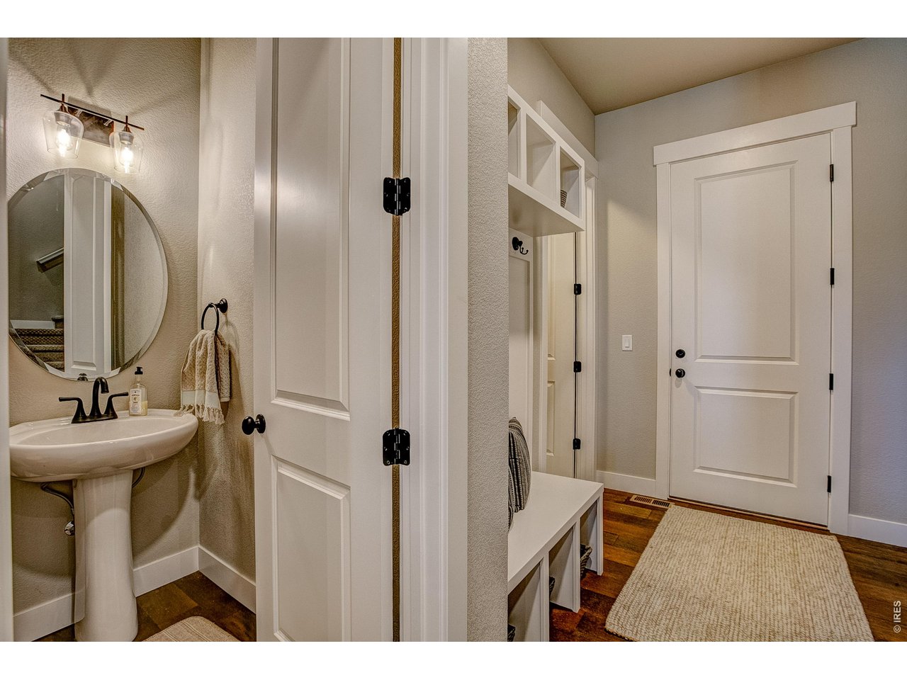 Property Photo 5 Main floor powder room. Finishes may vary.