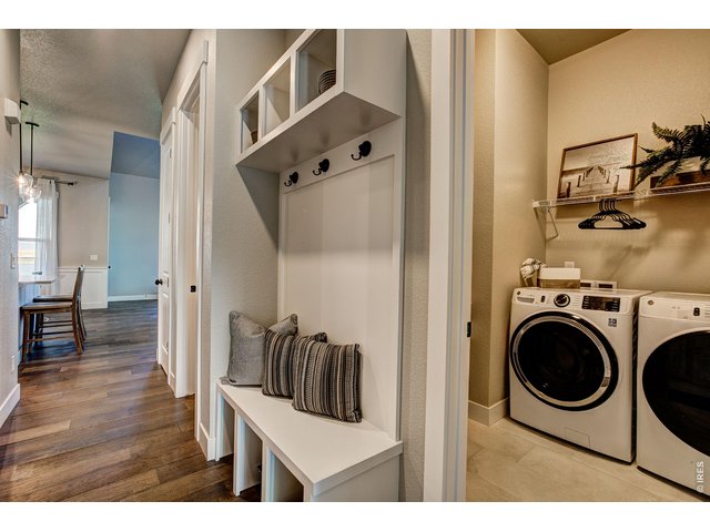 Property Photo 9 Main floor laundry. Finishes may vary.