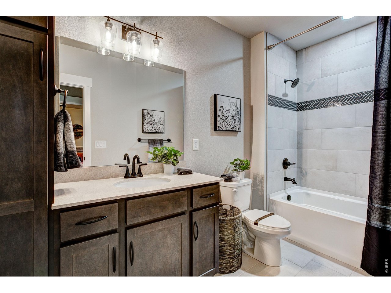Property Photo 19 Basement shared bathroom. Finishes may vary.