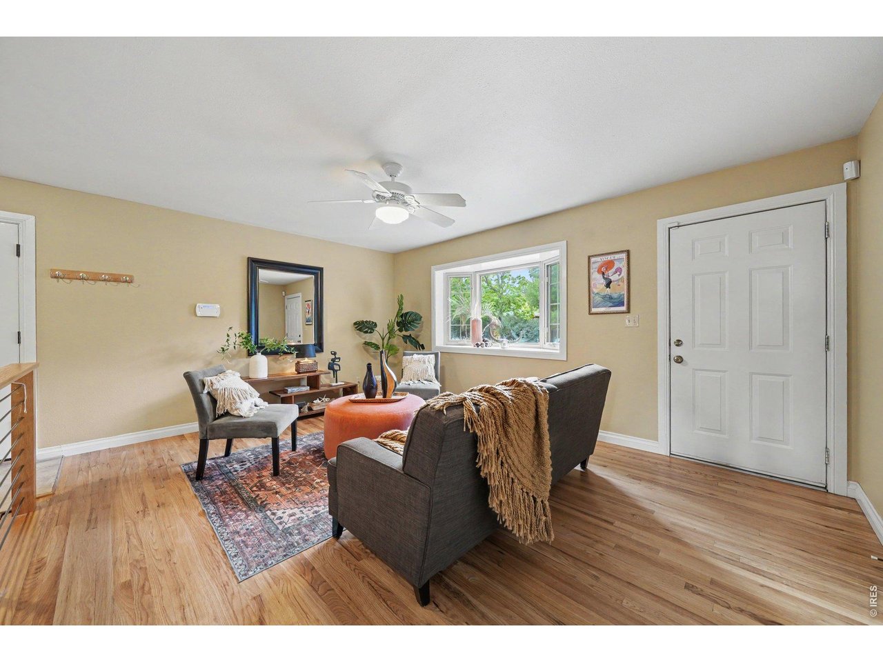 Property Photo 5 Hardwood floor and BIG BRIGHT BAY window in living room.