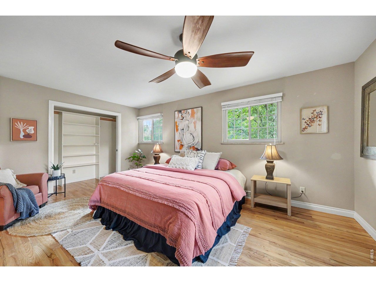 Property Photo 11 Oversized primary bedroom - hardwood floors.