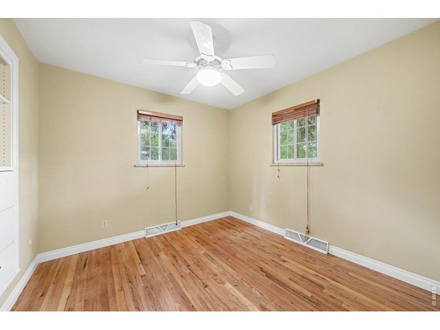 Property Photo 14 2nd Bedroom - hardwood floors and built-ins.