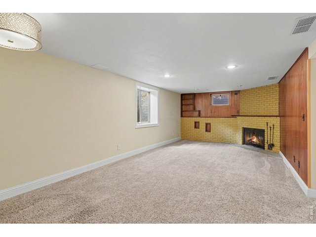 Property Photo 15 Large Family / Rec Room with Wood Burning Fireplace