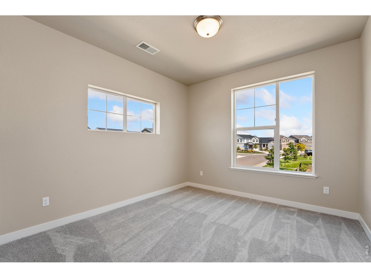 Property Photo 18 Second bedroom. Finishes may vary.