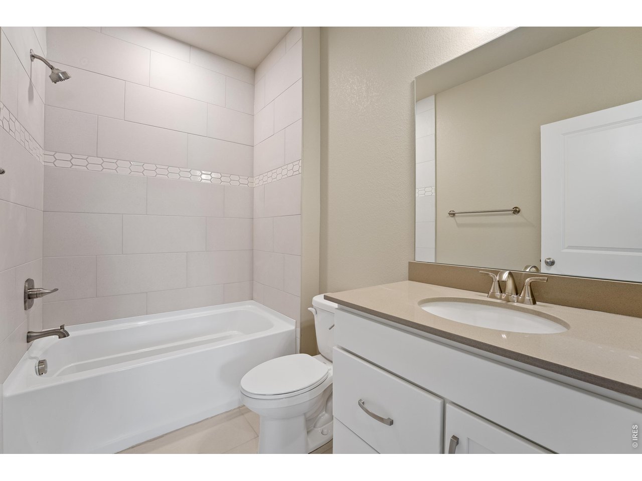 Property Photo 20 Shared bathroom upstairs. Finishes may vary.
