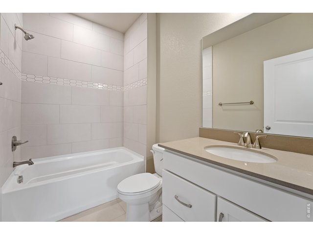 Property Photo 20 Shared bathroom upstairs. Finishes may vary.