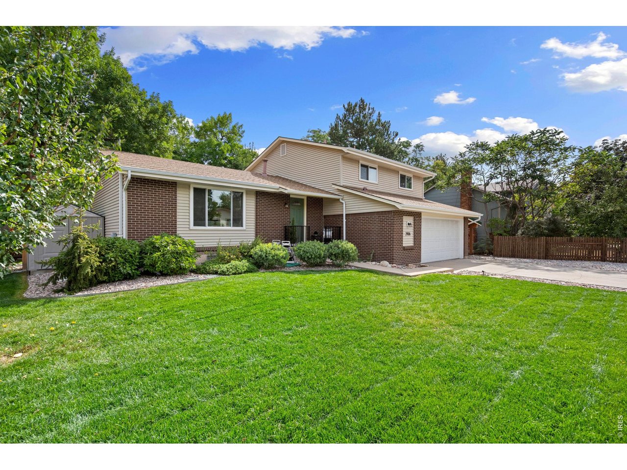 Property Photo 1 This beautiful yard has a sprinkler system for easy maintenance.
