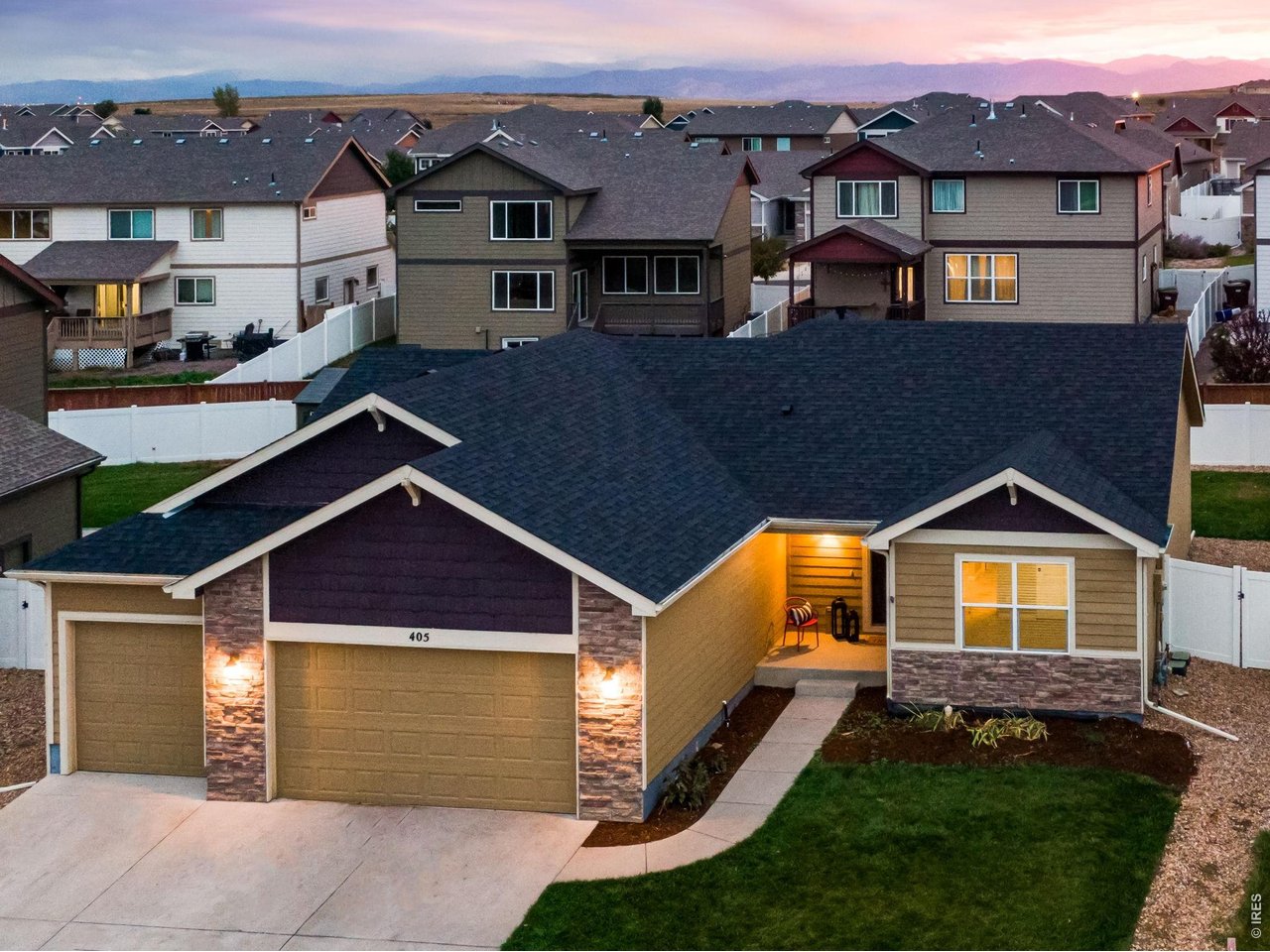 Property Photo 14 Brand New Class IV impact resistant roof & an Oversized 3 car garage at 763 SQFT with the double bay 24 FT in length - perfect for larger vehicles and SUVs.