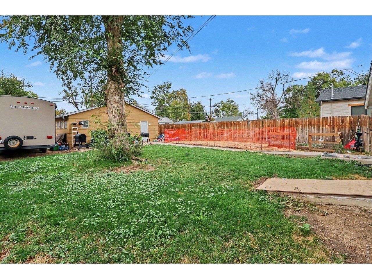 Property Photo 20 View of backyard from home.  Alley access with a gate to back yard for RV storage! Nice patio along the garage area