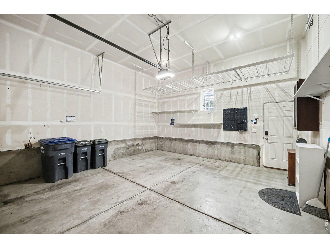 Property Photo 20 Oversized Garage with built in storage 13' high ceilings