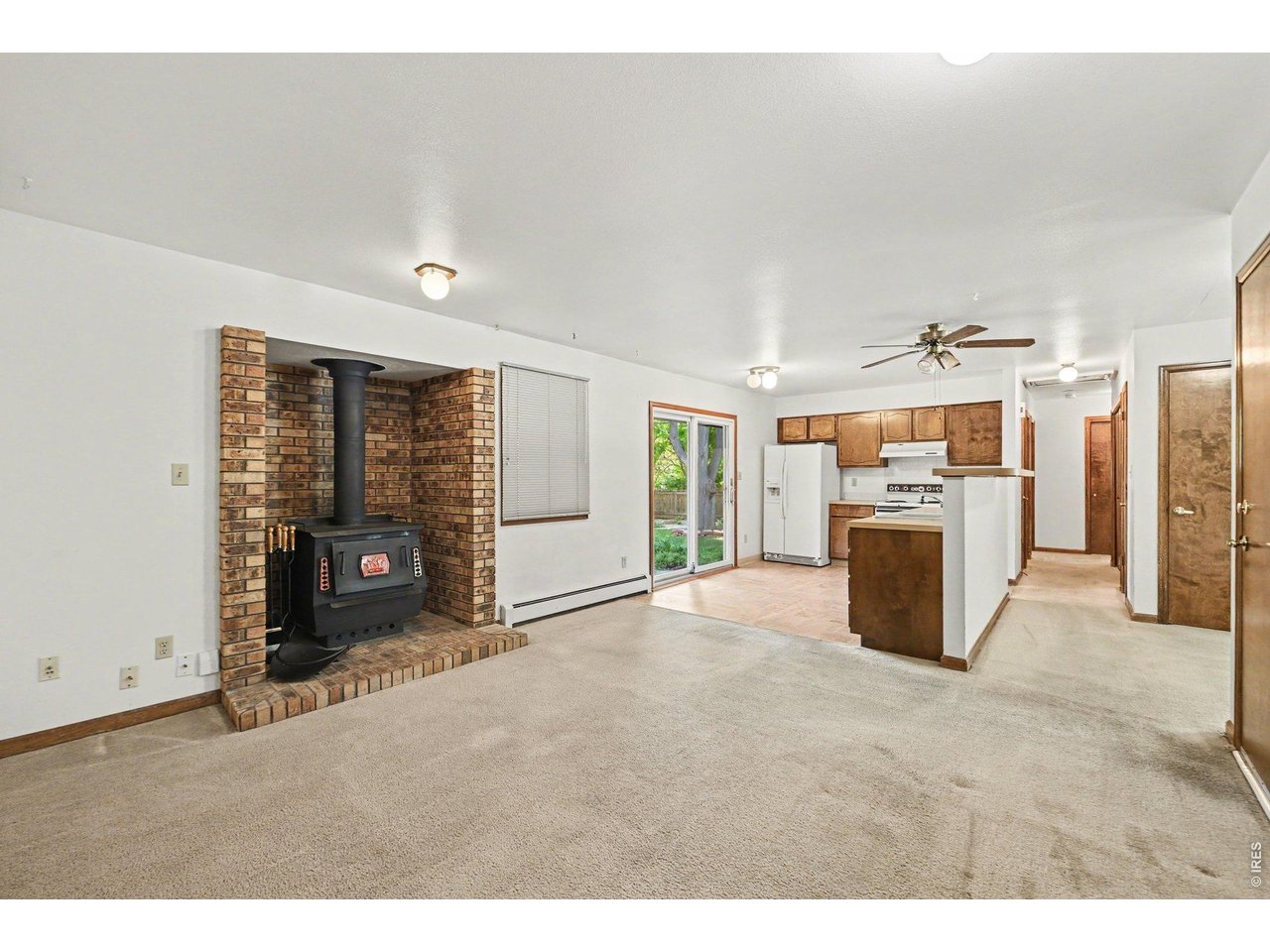 Property Photo 7 Open kitchen makes it easy between the patio door, dining/entertainment space and hallway.
