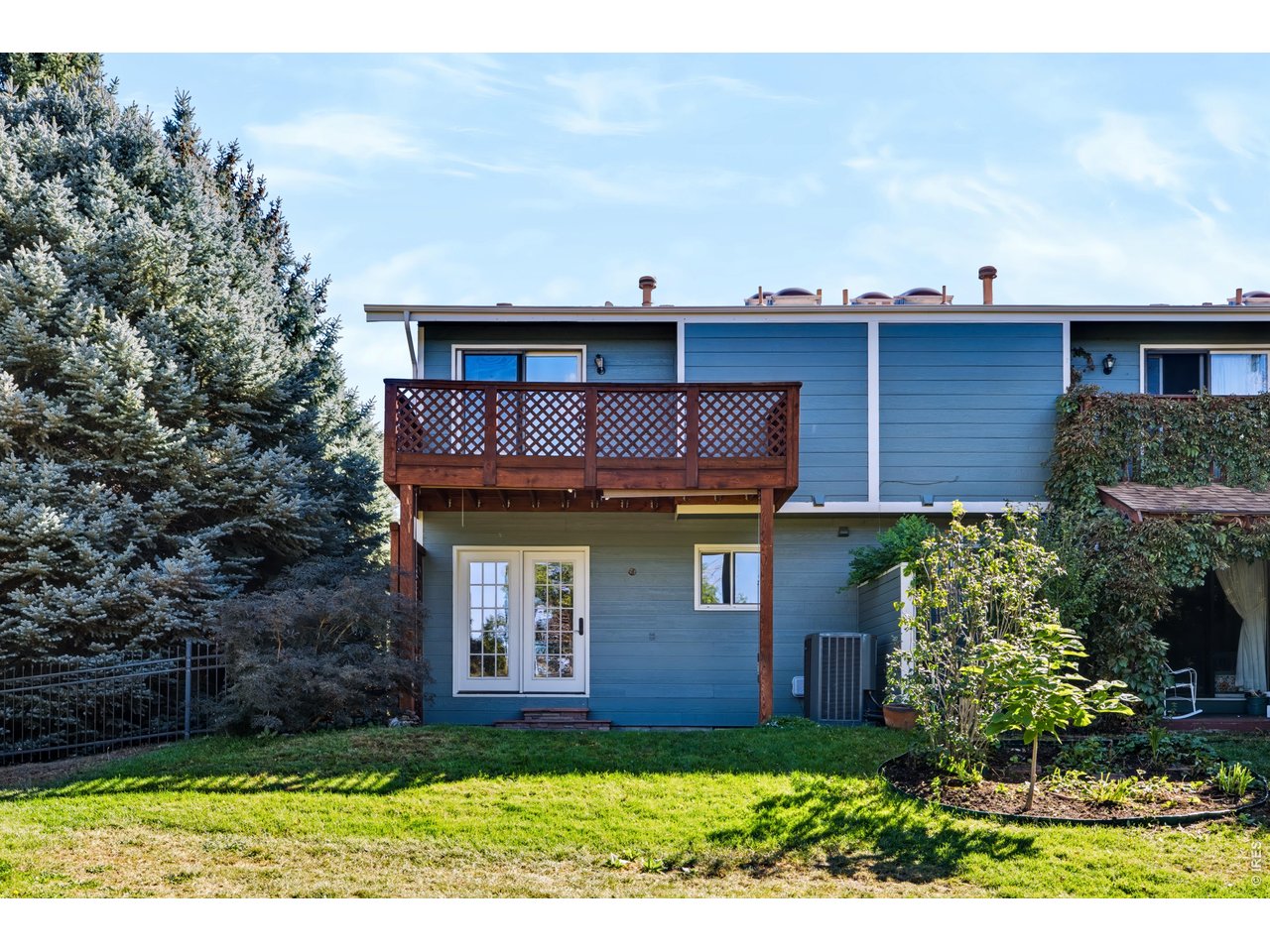 Property Photo 2 The back side of this lovely townhome backs to a private meadow with ponds.  (No public access to the meadow)