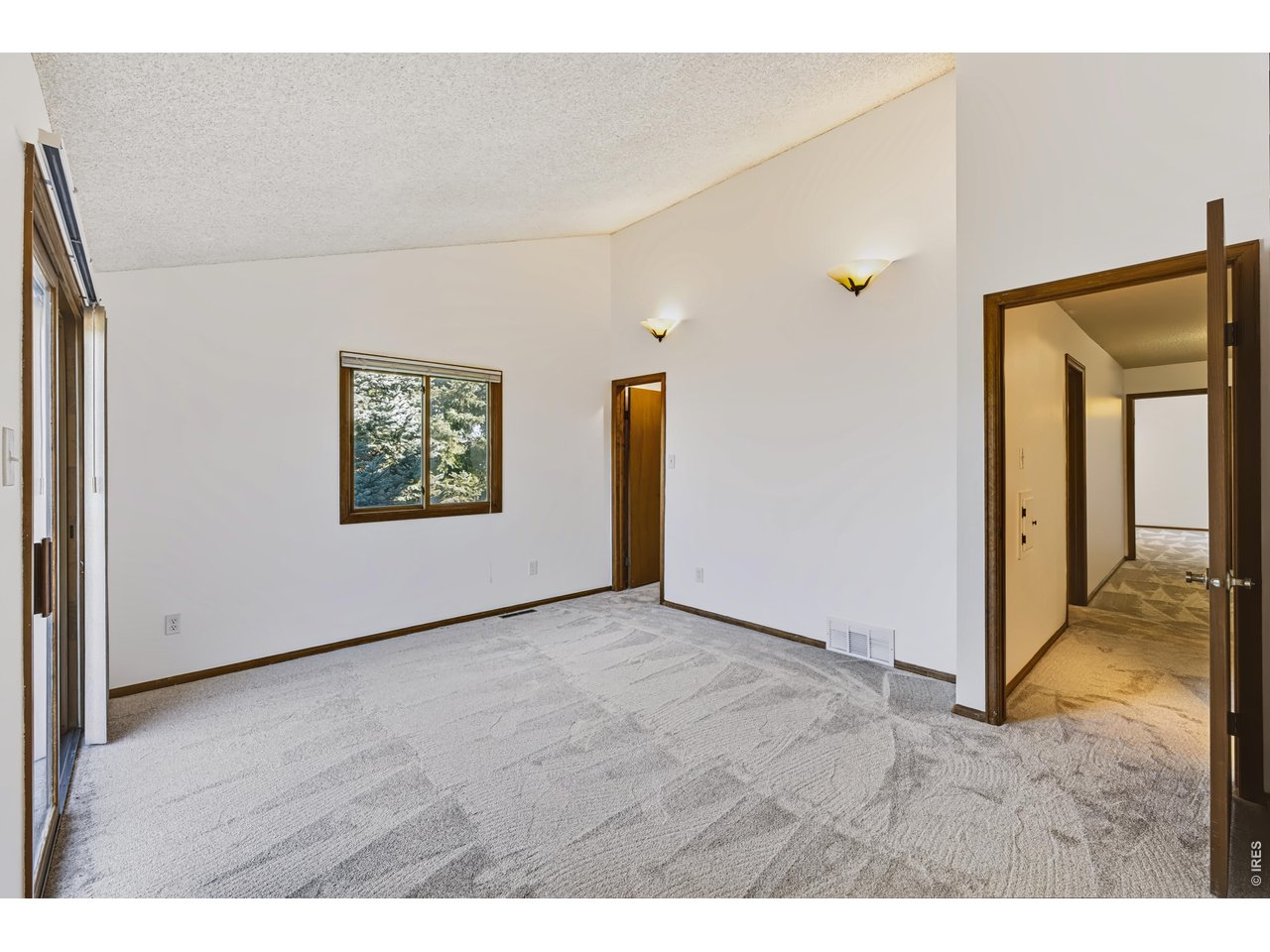 Property Photo 24 Primary Suite with walk-in closet and brand new carpet!