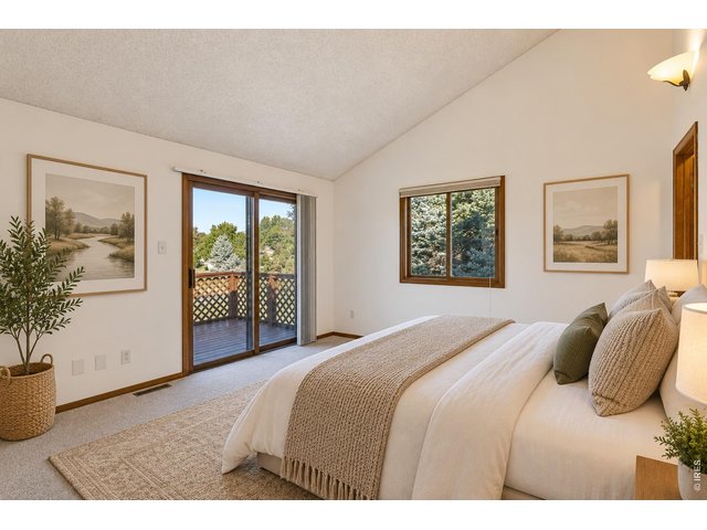 Property Photo 25 Primary Suite leads to the west-facing balcony. Virtually Staged.
