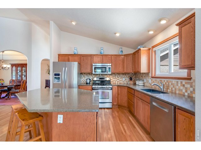 Property Photo 13 Beautiful, spacious kitchen featuring quartz countertops and an abundance of storage space
