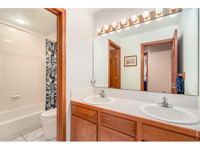 Property Photo 29 Main floor secondary bathroom features separate room for shower and toilet