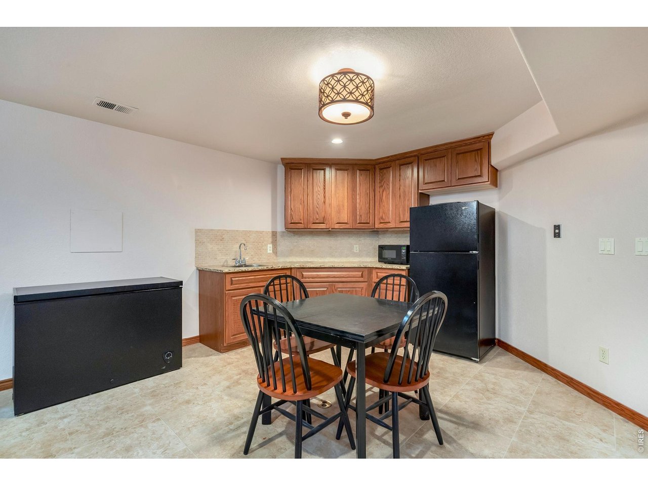 Property Photo 34 Enjoy Tharp custom cabinets in this additional space in the basement