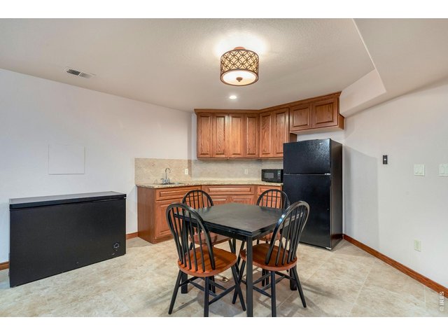 Property Photo 34 Enjoy Tharp custom cabinets in this additional space in the basement