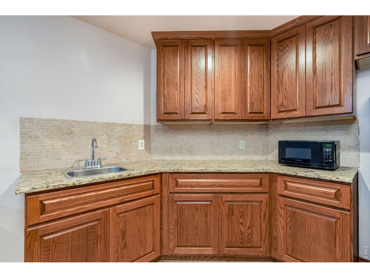 Property Photo 35 Enjoy Tharp custom cabinets in this additional space in the basement