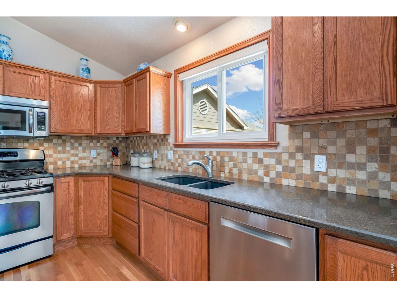 Property Photo 14 Stainless steel appliances and large east facing window above the sink