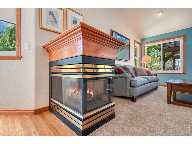 Property Photo 18 Cozy gas fireplace in the main living area, perfect for relaxing evenings.