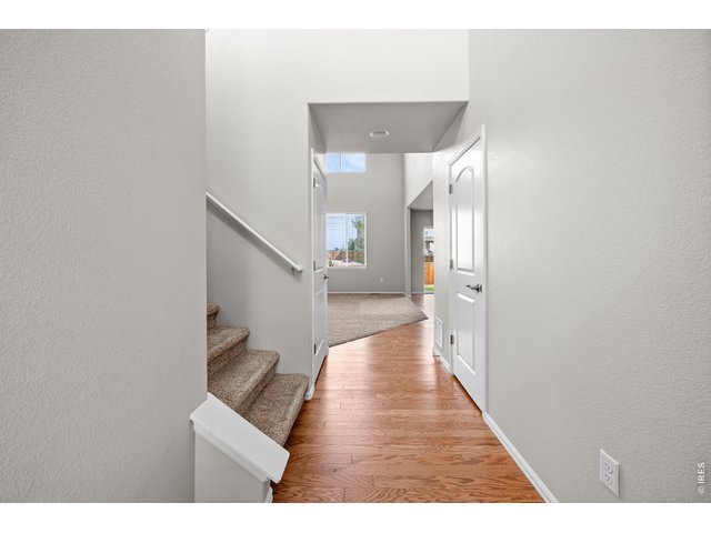 Property Photo 7 Upstairs leads to 4 Bedrooms and a Laundry Room