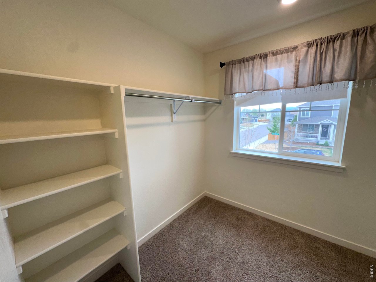 Property Photo 20 Primary Walk-in Closet