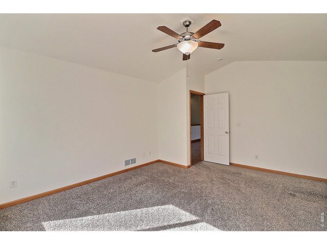 Property Photo 16 Primary Bedroom with Vaulted Ceilings